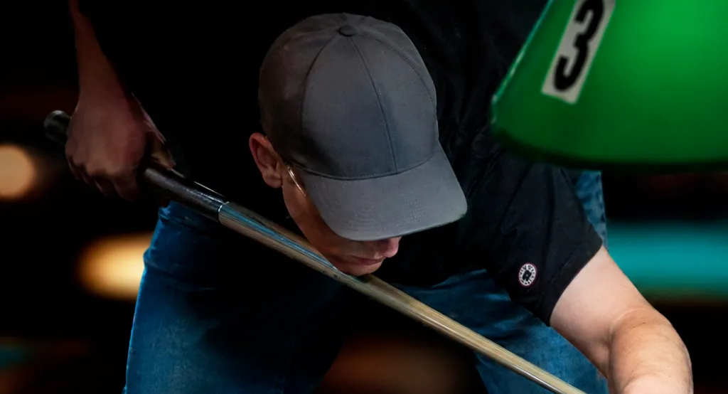 Player breaking the rack in an 8-ball game